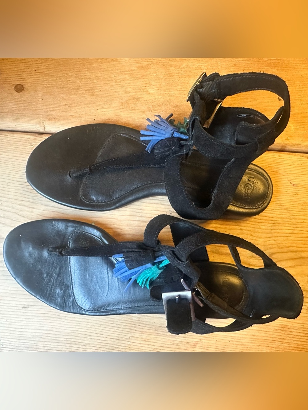 Ugg black suede gladiator sandals with green & blue tassles.
